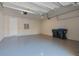 Large garage with epoxy flooring and extra storage space at 8324 Vivaro Isle Way, Windermere, FL 34786