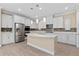 Modern kitchen featuring white cabinets, marble island, and stainless steel appliances at 8324 Vivaro Isle Way, Windermere, FL 34786