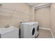 Laundry room with washer, dryer, and utility sink at 8324 Vivaro Isle Way, Windermere, FL 34786