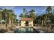 Resort-style pool with lounge chairs and a shaded seating area at 8324 Vivaro Isle Way, Windermere, FL 34786