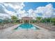 Community pool with plenty of lounge chairs and a covered seating area at 8324 Vivaro Isle Way, Windermere, FL 34786