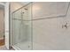 Large walk-in shower with glass enclosure and modern fixtures at 8324 Vivaro Isle Way, Windermere, FL 34786