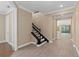 Elegant staircase with dark wood railing and white risers at 8324 Vivaro Isle Way, Windermere, FL 34786