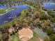 Aerial view of community featuring lake, playground, and basketball court at 837 Ashbrooke Ct, Lake Mary, FL 32746