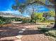 Landscaped backyard with a hammock and stone pathway at 837 Ashbrooke Ct, Lake Mary, FL 32746