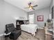 Relaxing bedroom with plush chair and ceiling fan at 837 Ashbrooke Ct, Lake Mary, FL 32746