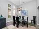 Elegant dining room featuring a glass-top table and six chairs at 837 Ashbrooke Ct, Lake Mary, FL 32746