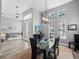 Bright dining room with glass table and modern lighting at 837 Ashbrooke Ct, Lake Mary, FL 32746