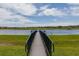 Wooden dock extending over calm lake waters at 837 Ashbrooke Ct, Lake Mary, FL 32746