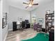 Home office with built-in shelving and putting green at 837 Ashbrooke Ct, Lake Mary, FL 32746