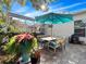 Relaxing patio with seating area, umbrella, and grill at 837 Ashbrooke Ct, Lake Mary, FL 32746