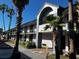 Two-story building with arched entryway and palms at 8421 S Orange Blossom Trl # 441, Orlando, FL 32809