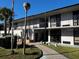 Two-story building with walkway and landscaping at 8421 S Orange Blossom Trl # 441, Orlando, FL 32809