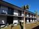 Two-story building with balconies and palm trees at 8421 S Orange Blossom Trl # 441, Orlando, FL 32809