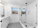 Modern bathroom with a large glass shower and marble tile at 105 Clyde Ave, Longwood, FL 32750