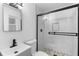 Small bathroom with a walk-in shower and pebble floor at 105 Clyde Ave, Longwood, FL 32750