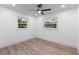 Well-lit bedroom with vinyl flooring and two windows at 105 Clyde Ave, Longwood, FL 32750