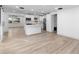 Modern kitchen with white shaker cabinets, island, and stainless steel appliances at 105 Clyde Ave, Longwood, FL 32750