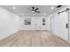 Spacious living area with vinyl plank flooring and barn door at 105 Clyde Ave, Longwood, FL 32750