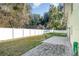 Landscaped backyard with patio and white vinyl fence at 109 Wynot Way, Deland, FL 32724