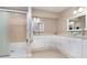 Bathroom with double vanity, glass sinks, and a walk-in shower at 109 Wynot Way, Deland, FL 32724