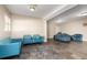 Common area with blue couches and tile flooring at 109 Wynot Way, Deland, FL 32724