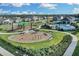 Community playground with play structures and fitness area at 1122 Seaside Mist Trl, Kissimmee, FL 34747