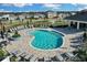 Resort-style pool with plenty of lounge chairs at 1122 Seaside Mist Trl, Kissimmee, FL 34747