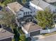 Aerial view showcasing a house with a detached garage at 11560 Ashlin Park Blvd, Windermere, FL 34786