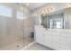 Elegant bathroom with a walk-in shower and double vanity at 11560 Ashlin Park Blvd, Windermere, FL 34786