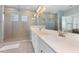 Spa-like bathroom with a large walk-in shower and double sinks at 11560 Ashlin Park Blvd, Windermere, FL 34786