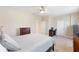 Well-lit bedroom with a queen bed and built-in desk area at 11560 Ashlin Park Blvd, Windermere, FL 34786