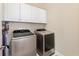 Bright laundry room with modern washer and dryer at 11560 Ashlin Park Blvd, Windermere, FL 34786