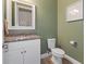 Modern powder room with granite countertop and updated fixtures at 11560 Ashlin Park Blvd, Windermere, FL 34786