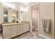 Elegant bathroom with double vanity, large mirror, and separate toilet area at 11748 Waterstone Loop Dr, Windermere, FL 34786