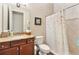 Bathroom with granite countertop, shower, and toilet at 11748 Waterstone Loop Dr, Windermere, FL 34786