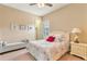 Spacious bedroom with a comfortable bed, bench and nightstand at 11748 Waterstone Loop Dr, Windermere, FL 34786