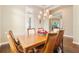 Bright dining room with hardwood floors, large windows and a chandelier at 11748 Waterstone Loop Dr, Windermere, FL 34786