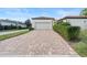 Brick driveway leading to a garage at 11748 Waterstone Loop Dr, Windermere, FL 34786