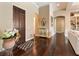 Elegant entryway with dark hardwood floors and decorative accents at 11748 Waterstone Loop Dr, Windermere, FL 34786