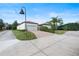 House exterior with driveway and landscaping at 11748 Waterstone Loop Dr, Windermere, FL 34786