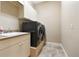 Laundry room with washer, dryer, and utility sink at 11748 Waterstone Loop Dr, Windermere, FL 34786