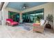 Relaxing covered patio with wicker furniture and tiled floor at 11748 Waterstone Loop Dr, Windermere, FL 34786