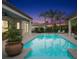 Peaceful pool area at sunset with a spa and patio seating at 11748 Waterstone Loop Dr, Windermere, FL 34786