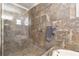 Large walk-in shower with tile surround and built-in seat at 11748 Waterstone Loop Dr, Windermere, FL 34786