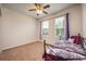 Bright bedroom with window and neutral wall at 121 Whirlaway Dr, Davenport, FL 33837