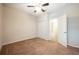 Bedroom with carpet flooring and door to bathroom at 121 Whirlaway Dr, Davenport, FL 33837