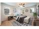 Spacious bedroom with a ceiling fan and large windows at 121 Whirlaway Dr, Davenport, FL 33837