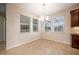 Dining room with tile floor and large windows at 121 Whirlaway Dr, Davenport, FL 33837