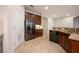 Modern kitchen with dark wood cabinets and granite countertops at 121 Whirlaway Dr, Davenport, FL 33837